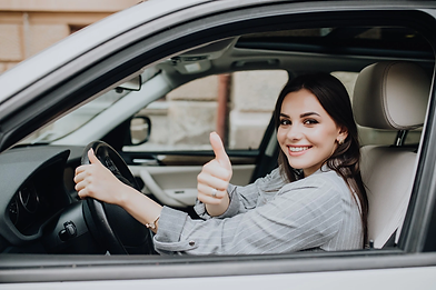 beautiful-young-latin-woman-driving-her-brand-new-car-showing-her-thumb-up_231208-7751.web