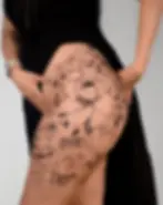Fine line large scale botanical floral hip and thigh tattoo