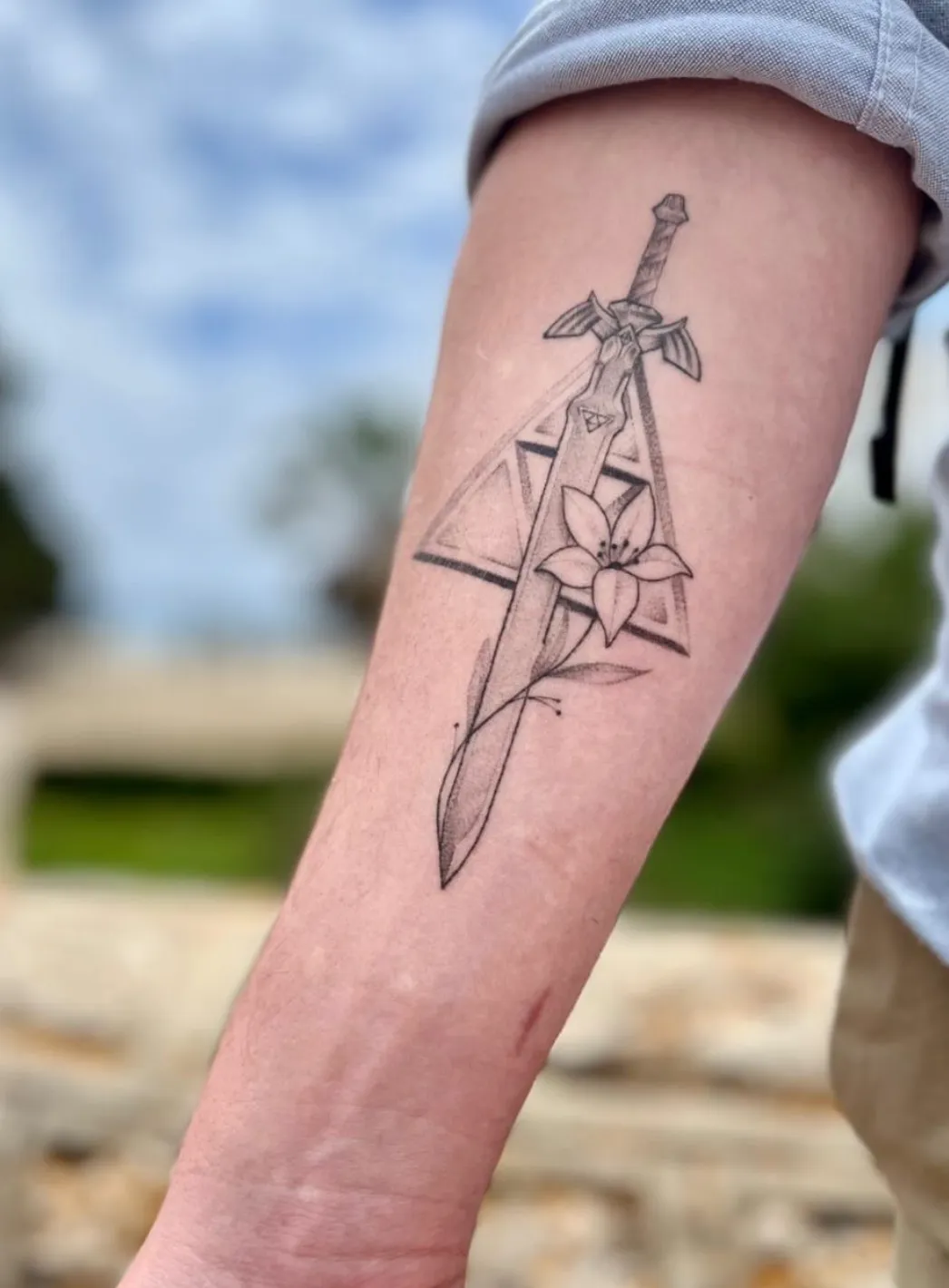 Healed fine line Zelda Master Sword forearm tattoo by Anggi