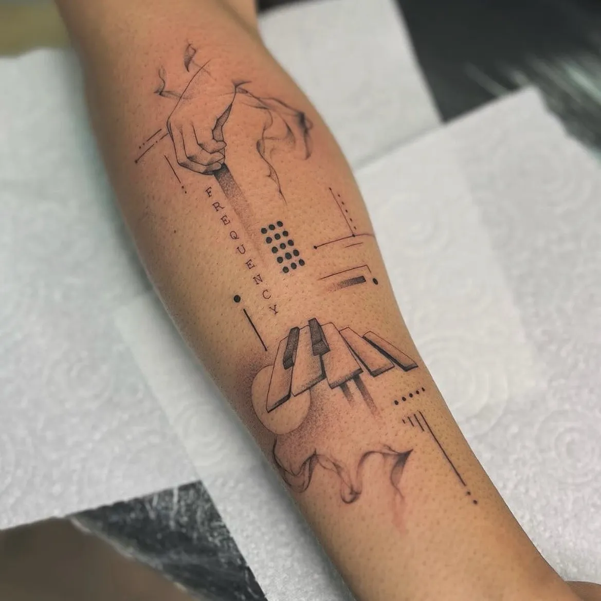 Fine line music piano and frequency forearm tattoo by Anggi at The Story of Us MCR, Castlefield Manchester