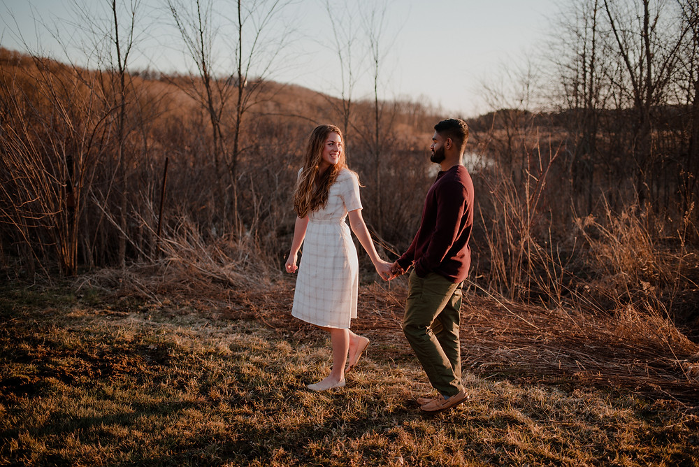 outdoors field romantic sunset engagement photo
