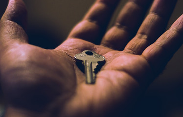 Hand holding a key