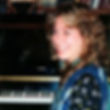 Seated at piano cropped.jpg