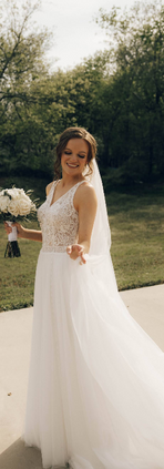 Bride and groom standing outside wedding venue