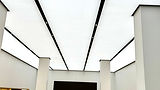 White ceiling with black lines and spotlights; interior design; printed stretch ceilings