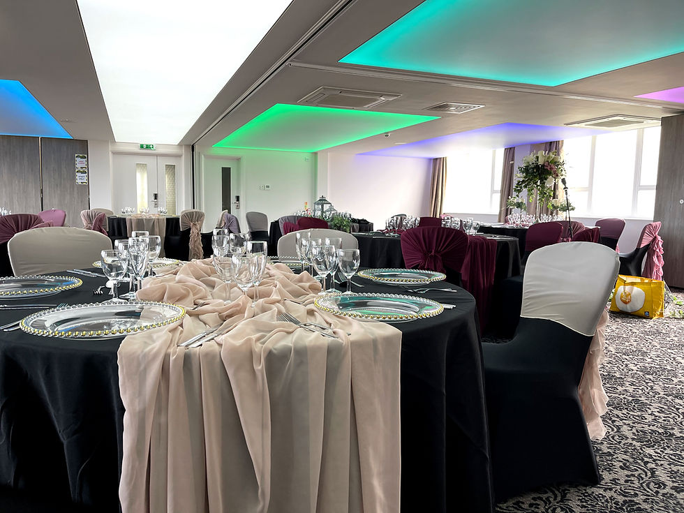 Close-up view of a stylish living room with a translucent stretch ceiling softly illuminated