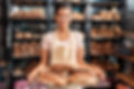 Young woman wearing apron assistant at friendly bakery shop small business holding rye bre