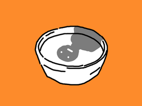 A white bowl of soup with the shade of an emotionless person in the liquid.