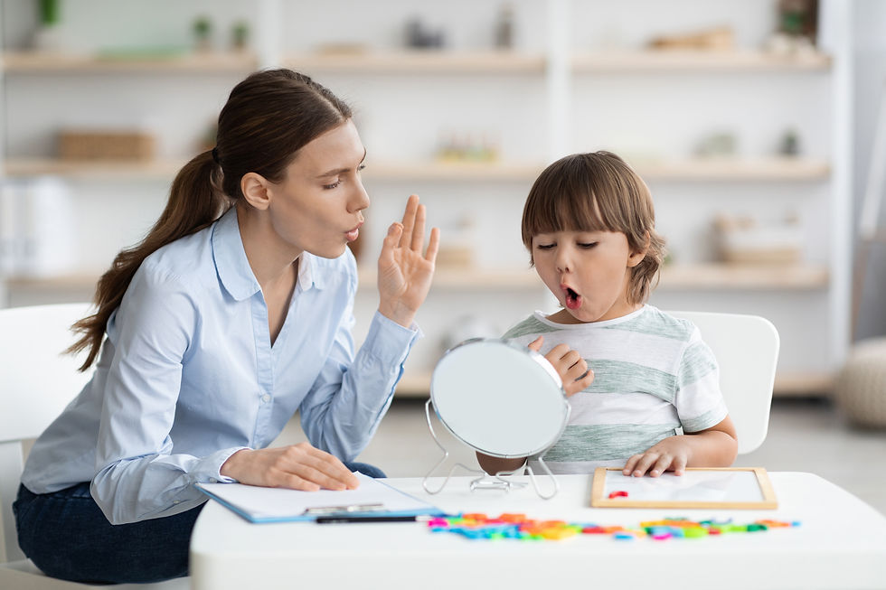 Speech therapy concept. Cute little boy pronouncing sound O looking at mirror, professiona