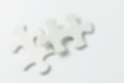 two-pieces-of-white-jigsaw-puzzle-D2TPZR