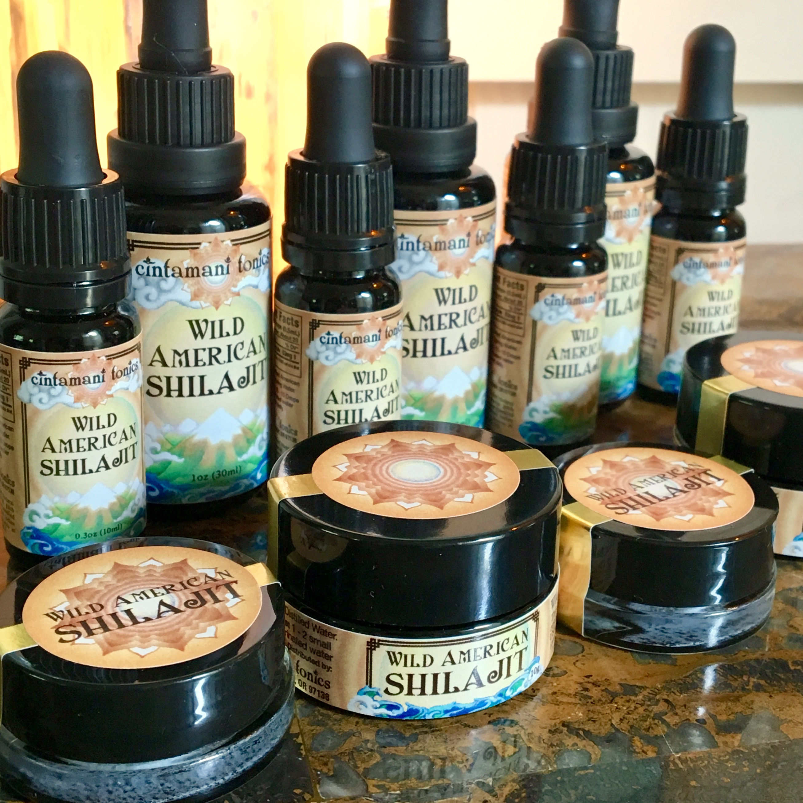 Wild American Shilajit Mineral Solution dropper bottles and Mineral Resin Jars on display