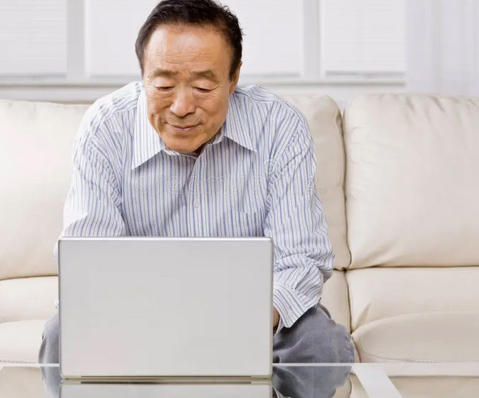 Man with Parkinson's learning a new skill of how to use a computer.