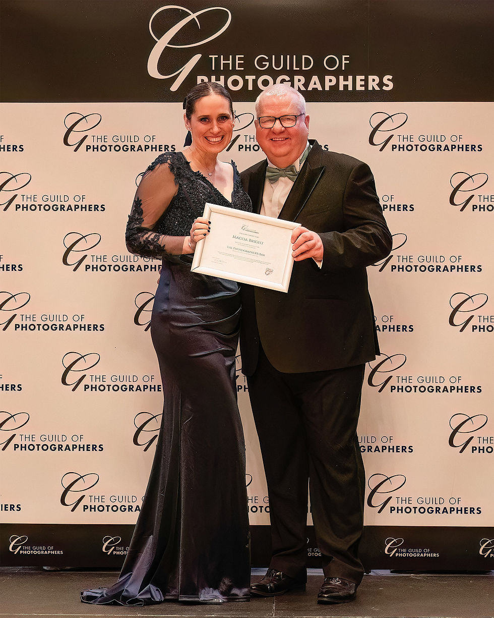 Magda receiving one of her certificates during the award ceremony with the Guild of Photographers