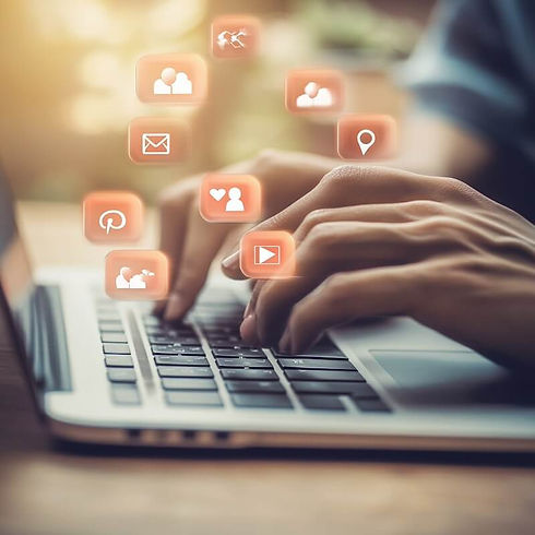 A closeup of a persons hands as they type on a laptop. Elton Cilliers social media manager