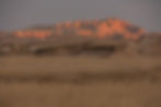 badlands rock formation lighting up at sunset at the national park