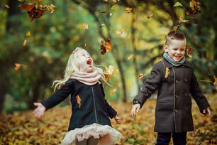 Two children in a park in Autumn