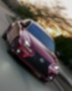 Maroon Lexus driving at sunset in a photography portfolio