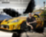 Man kneeling by a yellow sports car in a photography portfolio