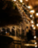 Outdoor cafe trees wrapped in lights from a photography portfolio.