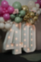 Large lighted marquee number 40 for a photography portfolio