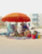 Beach photography portfolio shot of a woman and dog.