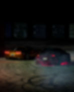 Two sports cars drifting at night for a photography portfolio