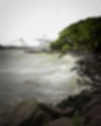 Waves crashing on a rocky shore in a photography portfolio.