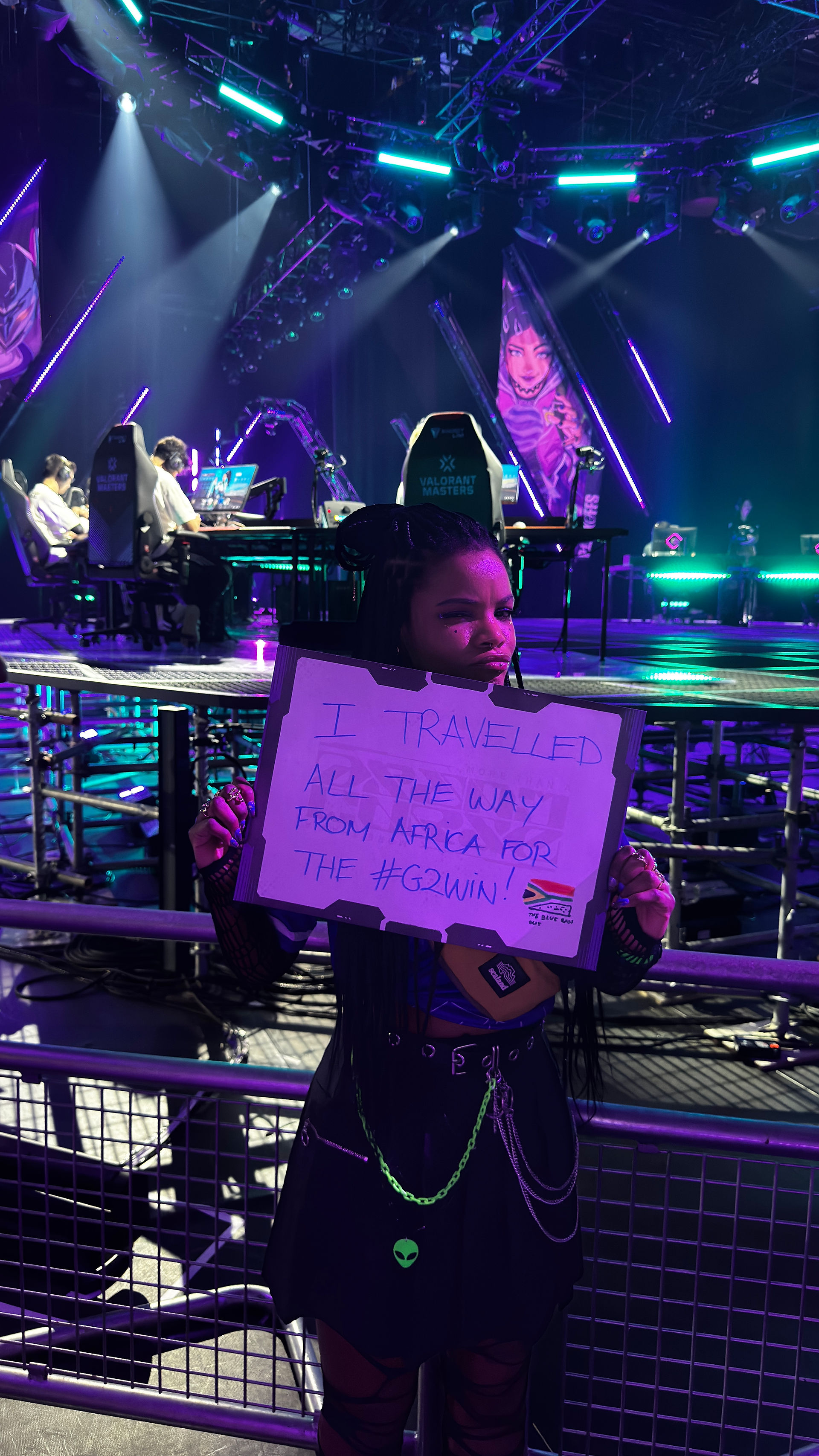 Andy with a poster at VCT. The poster reads “I travelled all the way from Africa for the #G2Win”