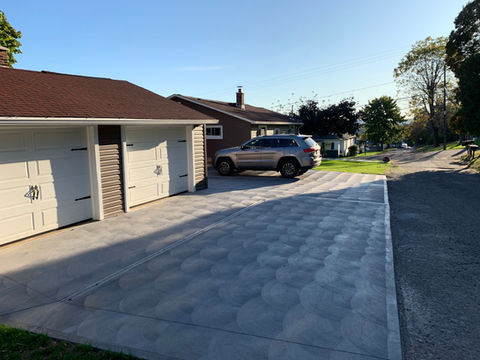 poured concrete driveway with brushed scalloping finish