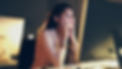 Young woman staring at computer late night