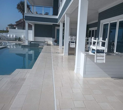 beautiful modern-looking pool deck with fresh pavers