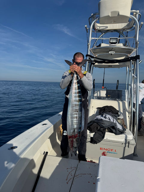 anglers posing with his catch