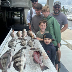 anglers posing with their catch
