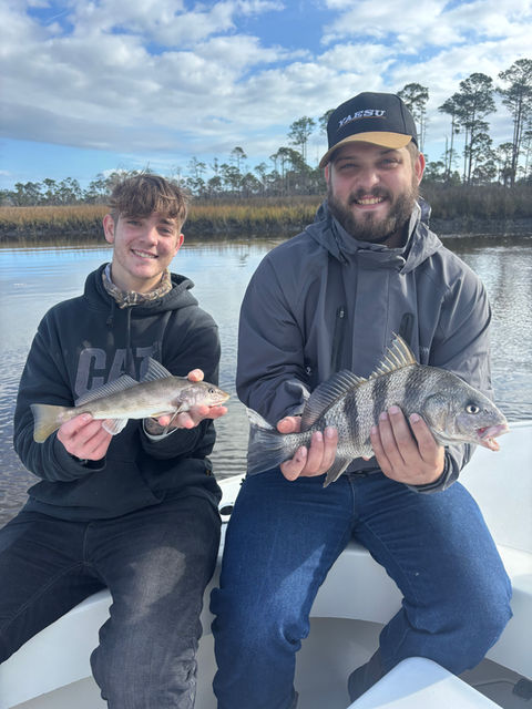 anglers posing with their catch