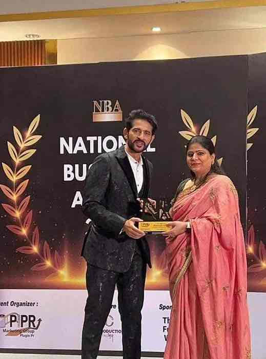 Man receiving National Business Award