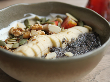 Image shows high protein Greek yoghurt, seed and fruit breakfast