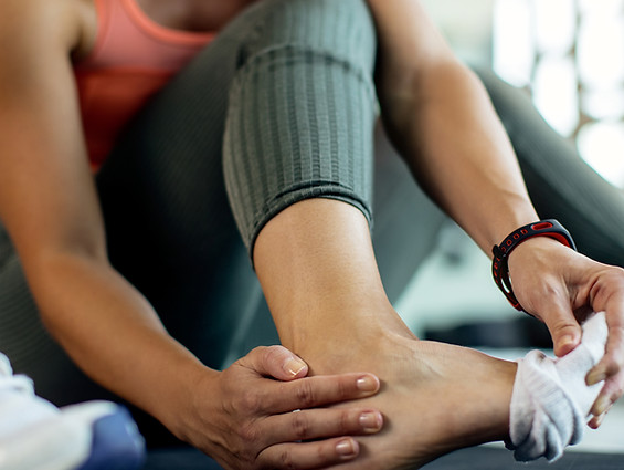closeup-athletic-woman-injured-her-foot-workout-gym.jpg