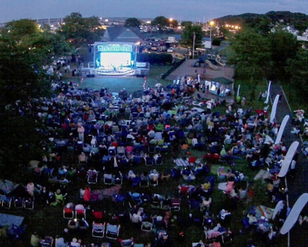 Aerial view of a movie screen and people gathered to  watch at the Atlantic Highlands Film One Fest