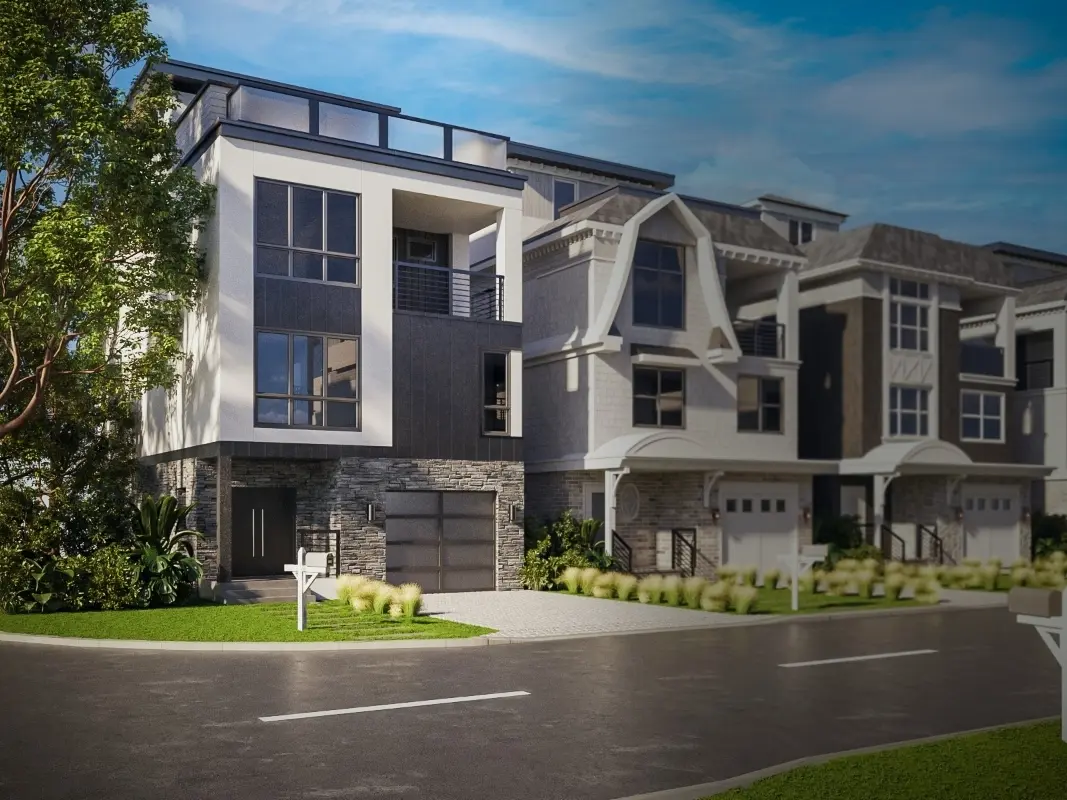 Exterior view of the Sea Glass model home at BeachWalk, featuring light coastal tones, white trim, expansive windows, and elegant seaside-inspired architecture designed by Cross Builders