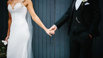 Bride and Groom holding hands