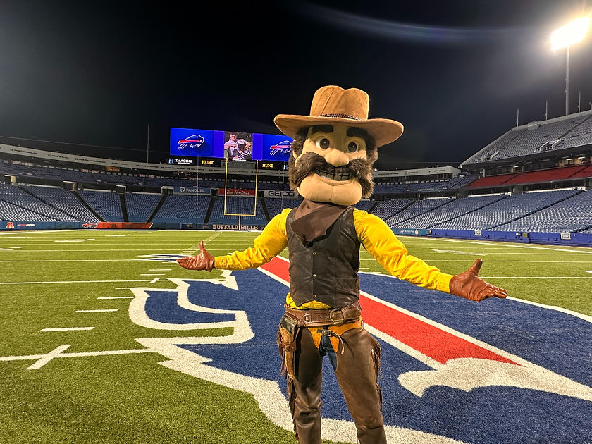 A cowboy mascot stands on the Buffalo Bills field.