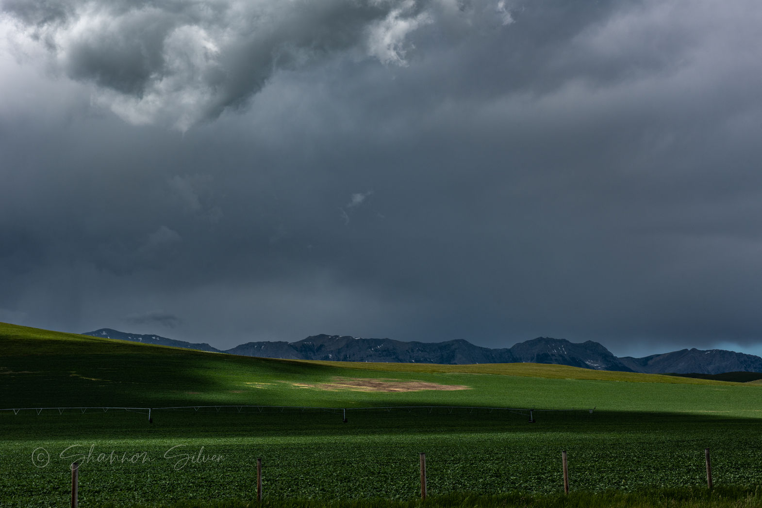 Sunlight breaking through storm clouds during a spring tempest