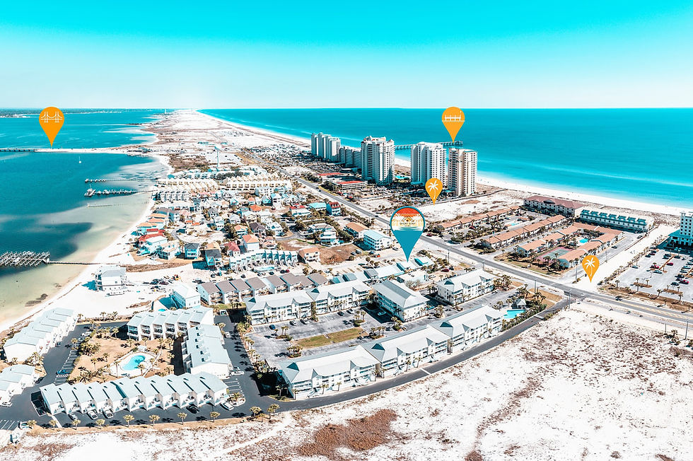 Aerial view of Navarre Beach, Florida, showcasing Short Stay Haven's location near the Gulf of Mexico and surrounding attractions, with clear blue skies and a mix of residential and beachside buildings.