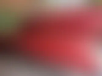 Stack of bright red canoes labeled “Blackwater Joe’s” stored on a rack at the Blackwater Joe’s Canoes facility in Okaloosa County, Florida.