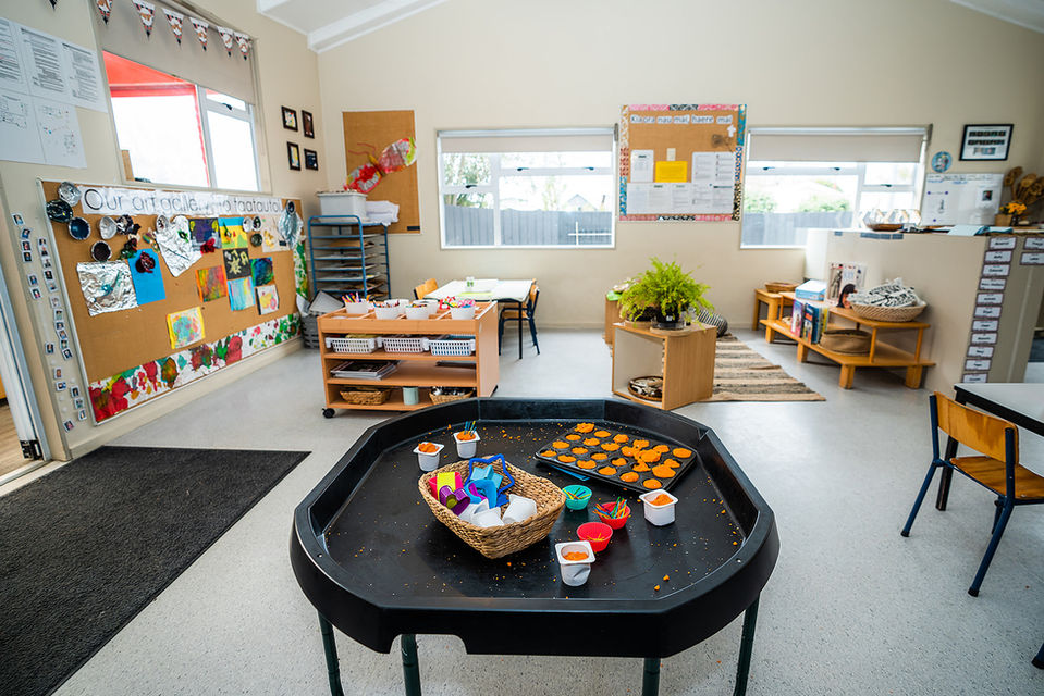 Making cupcakes with play dough at kindy