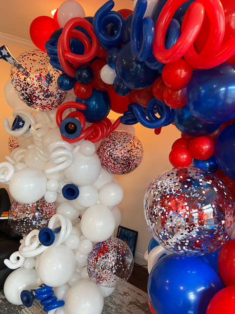 organic balloon arch in patriotic red white and blue with metallic confetti balloons for July 4th party in Society Hill at Droyer’s Point Jersey City NJ
