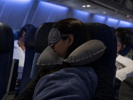 How to Sleep on a Plane, Even in a Middle Seat