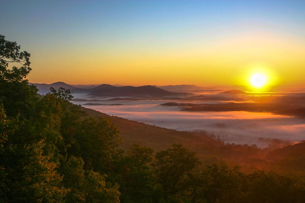 Layered Blue Ridge Mountains at sunrise in western North Carolina representing hope, reflection, and healing.