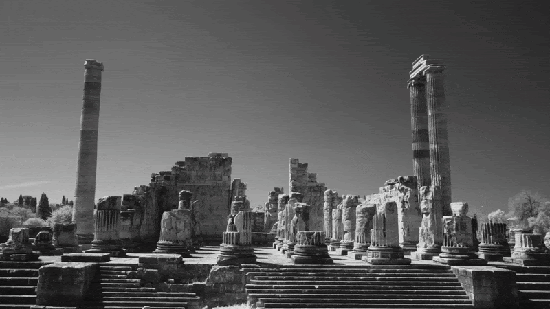 Architect Michele De Lucchi stands amid a vast stone landscape in ARCHITECTON.
