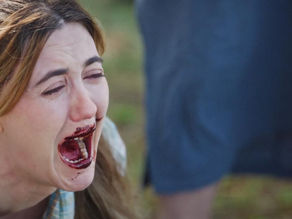 Madeline Zima in a tense scene from the folk horror film Love Is the Monster.